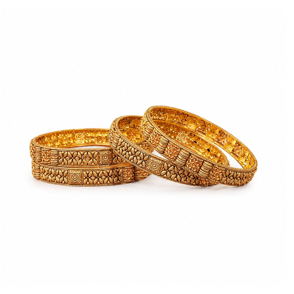 Decorative gold bangles on a red background